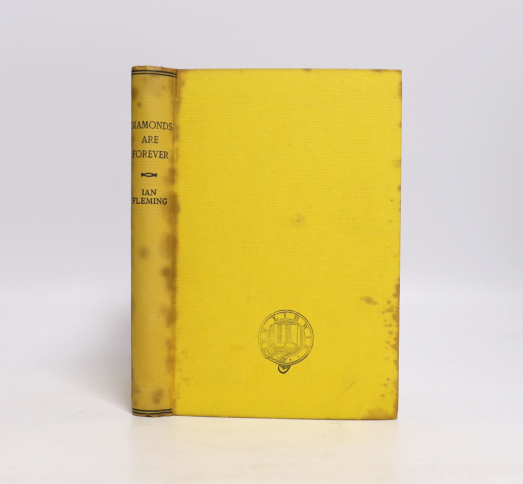 Fleming, Ian - Diamonds Are Forever, 1st edition, remainder copy, outside bound by others in yellow cloth (spine and boards spotted, front board stamped Ex Libris), 8vo, in an unclipped d/j, (leaves trimmed to 182 x122mm